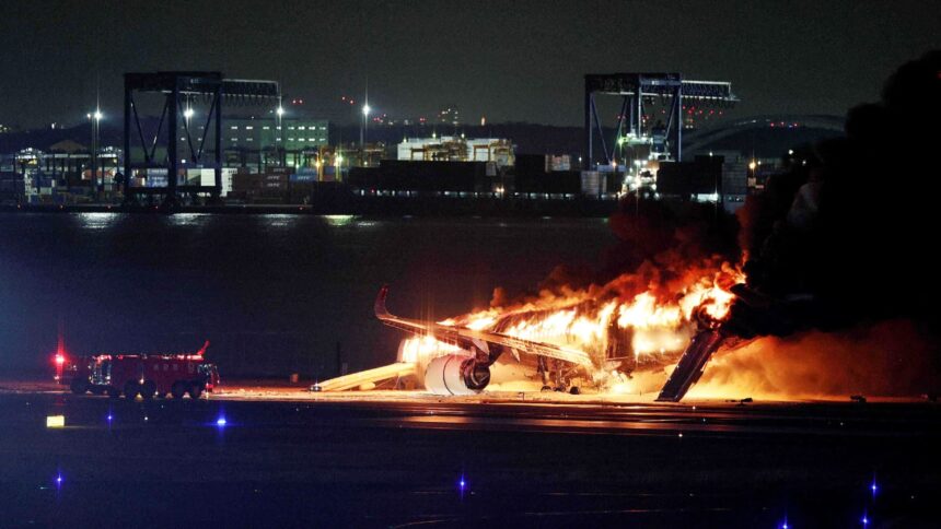 Japan Airlines plane in flames on runway at Tokyo airport