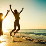 Happy,Kids,Playing,On,Beach,At,The,Sunrise,Time