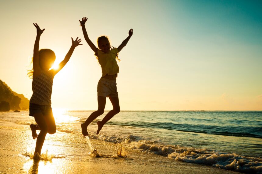 Happy,Kids,Playing,On,Beach,At,The,Sunrise,Time