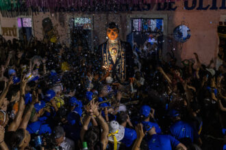 Brazil’s Carnival Only Starts When 12-Foot John Travolta Arrives