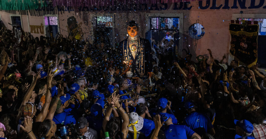 Brazil’s Carnival Only Starts When 12-Foot John Travolta Arrives