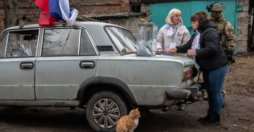 In Occupied Ukraine, Casting a Vote (for Putin) as Armed Soldiers Watch